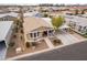 Aerial view of a tan house with landscaping and carport at 2263 N Trekell Rd # 72, Casa Grande, AZ 85122