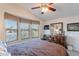 Bedroom with bay window and ceiling fan at 2263 N Trekell Rd, Casa Grande, AZ 85122