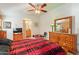 Bedroom with wood furniture and en-suite bathroom access at 2263 N Trekell Rd, Casa Grande, AZ 85122