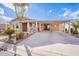 Tan single-story home with carport and landscaped yard at 2263 N Trekell Rd # 72, Casa Grande, AZ 85122