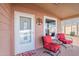 Inviting front porch with red chairs, creating a welcoming entrance at 2263 N Trekell Rd # 72, Casa Grande, AZ 85122