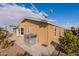 Tan home exterior with AC unit and satellite dish, showing rear view at 2263 N Trekell Rd, Casa Grande, AZ 85122