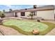 Putting green and patio in a sunny backyard at 22667 N 30Th Ave, Phoenix, AZ 85027