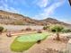 Putting green in a backyard with desert landscaping at 22667 N 30Th Ave, Phoenix, AZ 85027