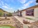 Backyard patio with putting green and cactus plants at 22667 N 30Th Ave, Phoenix, AZ 85027