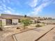 Home's backyard features a putting green and bocce ball court at 22667 N 30Th Ave, Phoenix, AZ 85027