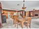 Kitchen and dining area combo with wood cabinets and tiled flooring at 22667 N 30Th Ave, Phoenix, AZ 85027