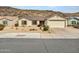 House exterior featuring a desert landscape and attached garage at 22667 N 30Th Ave, Phoenix, AZ 85027