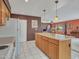 Kitchen island with seating overlooks the living and dining areas at 22667 N 30Th Ave, Phoenix, AZ 85027