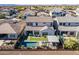 Aerial view showing a house with a pool and backyard in a quiet neighborhood at 23071 N 98Th Dr, Peoria, AZ 85383