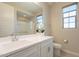 Clean bathroom with white vanity, shower, and large mirror at 23071 N 98Th Dr, Peoria, AZ 85383