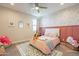 Charming bedroom with pink walls and floral wallpaper at 23071 N 98Th Dr, Peoria, AZ 85383