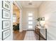 Bright and airy entryway with a marble console table at 23071 N 98Th Dr, Peoria, AZ 85383