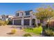 Two-story home with a welcoming front yard and landscaped yard at 23071 N 98Th Dr, Peoria, AZ 85383