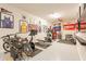 Garage gym with exercise equipment and sports memorabilia at 23071 N 98Th Dr, Peoria, AZ 85383