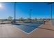 Outdoor pickleball court with a blue playing surface at 23071 N 98Th Dr, Peoria, AZ 85383