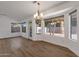 Dining area with large windows and wood-look floors at 23827 N 44Th Ln, Glendale, AZ 85310