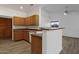 Kitchen with wood cabinets, and white appliances at 23827 N 44Th Ln, Glendale, AZ 85310