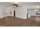 Open living room with wood-look floors and high ceilings at 23827 N 44Th Ln, Glendale, AZ 85310