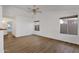 Living room with wood-look floors and backyard access at 23827 N 44Th Ln, Glendale, AZ 85310