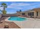 Inviting kidney-shaped pool with a large patio area at 23827 N 44Th Ln, Glendale, AZ 85310