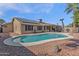 Inviting kidney-shaped pool with solar panels on the house in the background at 23827 N 44Th Ln, Glendale, AZ 85310