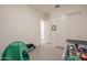 Neutral bedroom with a twin bed, carpet, and a walk-in closet at 23933 N 167Th Ln, Surprise, AZ 85387