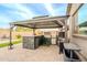 Outdoor kitchen featuring a built-in grill, bar, and ample counter space at 23933 N 167Th Ln, Surprise, AZ 85387