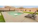 Sparkling pool with tanning ledge, surrounded by a well-maintained yard and patio area at 23933 N 167Th Ln, Surprise, AZ 85387