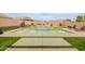 Sparkling pool with a spa, surrounded by lush green grass and ample seating at 23933 N 167Th Ln, Surprise, AZ 85387