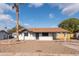 Charming single story home with a landscaped front yard and carport at 2446 E Marilyn Rd, Phoenix, AZ 85032