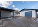 Detached garage with new paint and a large driveway at 2446 E Marilyn Rd, Phoenix, AZ 85032