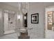 Bright dressing room featuring hardwood floors, a chandelier, and custom cabinets at 27545 N 97Th Pl, Scottsdale, AZ 85262