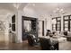 Bright living room featuring a bar and dark wood accents, and modern lighting at 27545 N 97Th Pl, Scottsdale, AZ 85262