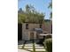 Outdoor kitchen and dining area with a built-in grill, undercounter refrigerator, and seating at 27545 N 97Th Pl, Scottsdale, AZ 85262