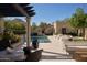 Luxury pool area featuring an outdoor lounge area with a pergola and ample seating at 27545 N 97Th Pl, Scottsdale, AZ 85262