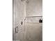 Modern tile shower with shower head, handle, marble niche and glass door at 27545 N 97Th Pl, Scottsdale, AZ 85262