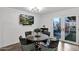 Charming dining area featuring a mounted TV and views of the fenced-in patio at 2912 E Clarendon Ave, Phoenix, AZ 85016