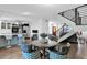 Cozy dining area featuring a modern light fixture, staircase, and seamless flow to other living spaces at 2912 E Clarendon Ave, Phoenix, AZ 85016