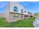 Well-maintained townhome with a freshly manicured lawn and modern architectural details at 2912 E Clarendon Ave, Phoenix, AZ 85016