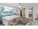 Bright main bedroom features a walk-in closet with sliding barn door and ensuite bathroom at 2912 E Clarendon Ave, Phoenix, AZ 85016