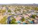 Wide aerial view of a community featuring mature trees, single-Gathering homes, and manicured landscaping at 2939 E Huber St, Mesa, AZ 85213