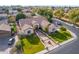 Stunning aerial view of a home with manicured lawn, beautiful landscaping, and brick-lined driveway at 2939 E Huber St, Mesa, AZ 85213