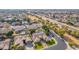 Scenic aerial shot of homes bordering a canal, with green lawns and neighborhood charm at 2939 E Huber St, Mesa, AZ 85213