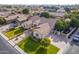 Aerial shot showcasing a home with a well-maintained yard, mature trees, and a wide driveway at 2939 E Huber St, Mesa, AZ 85213