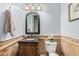 Charming powder room with decorative mirror and granite vanity at 2939 E Huber St, Mesa, AZ 85213