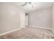 Bedroom with neutral carpeting and a ceiling fan at 2939 E Huber St, Mesa, AZ 85213