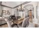 Elegant dining room with chandelier, table, and seating for eight, perfect for entertaining guests at 2939 E Huber St, Mesa, AZ 85213