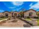 Beautiful home with meticulously maintained landscaping, palms, hardscape and an inviting entrance at 2939 E Huber St, Mesa, AZ 85213