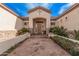 Welcoming front entrance with beautiful hardscape, stone accents and lush greenery at 2939 E Huber St, Mesa, AZ 85213